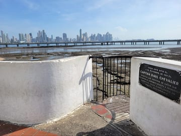 Modern Panama City skyline seen from Casco Viejo across mud flats
