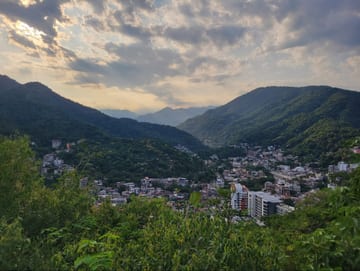 Looking east from the Puerto Vallarta mirador over green hills and the city